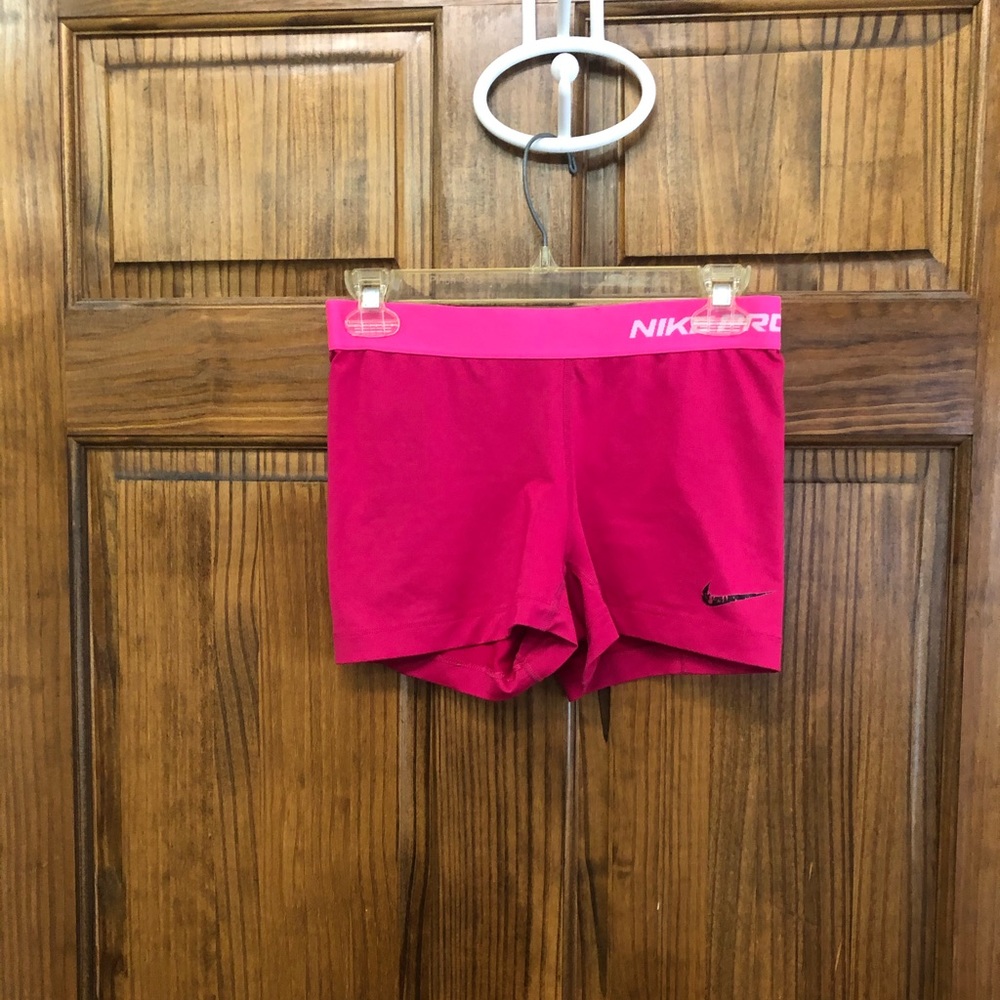Hot pink Nike spandex compression shorts
